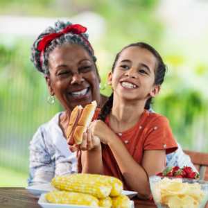 Grandma and child enjoying a fun BBQ in the park